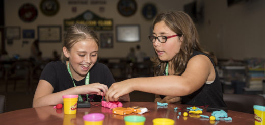 two girls playing with play dough