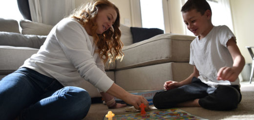 parent and child playing board game