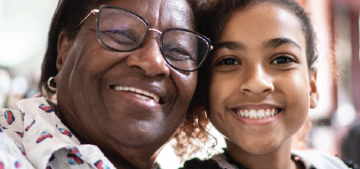 close up of Black grandmother with middle school aged granddaughter