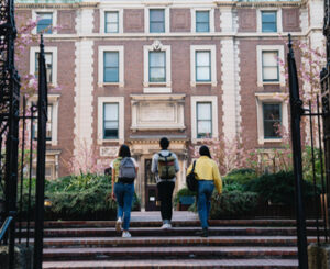 Students walking up to school building.