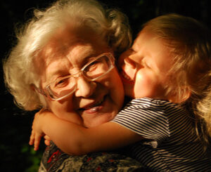 grandparent and grandchild hugging