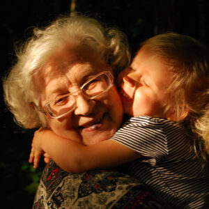 grandparent and grandchild hugging